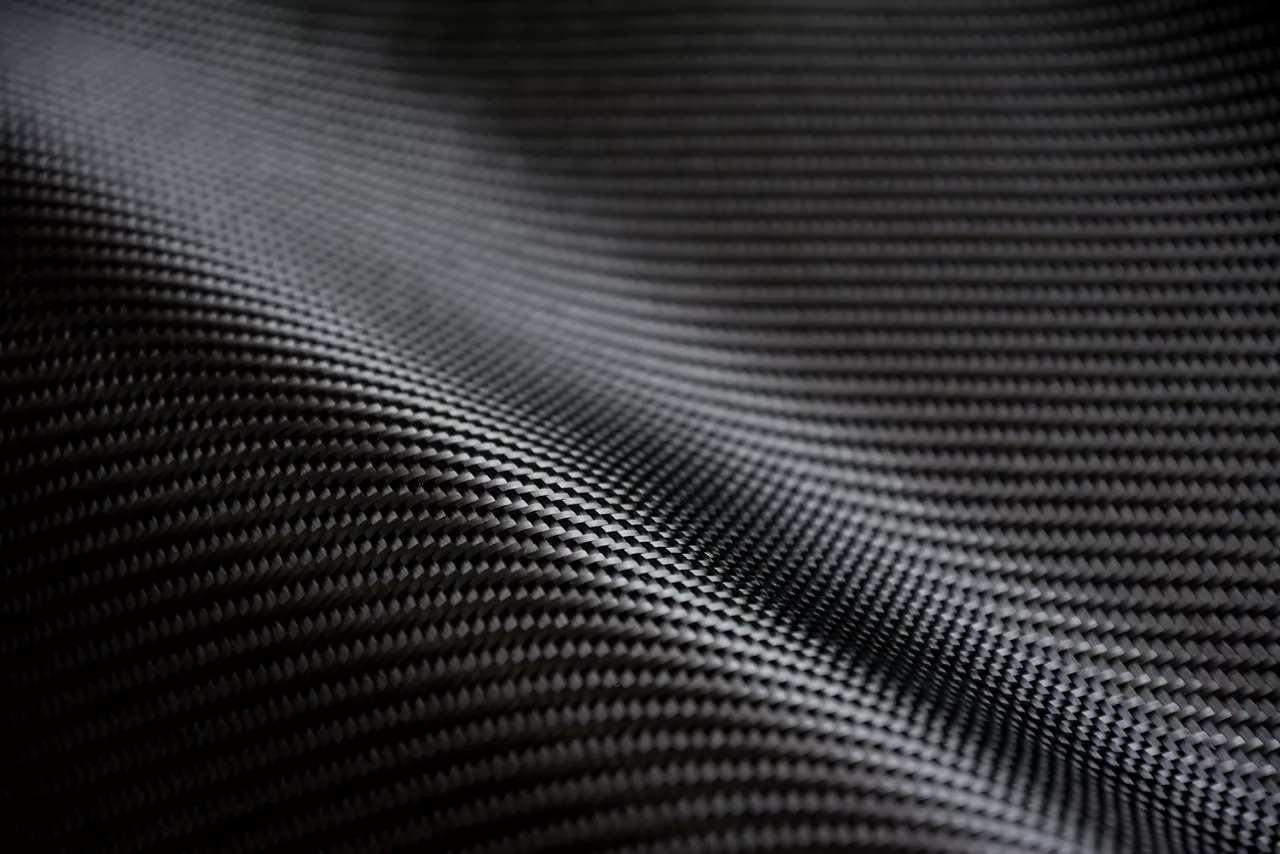 Black carbon fiber composite raw material background