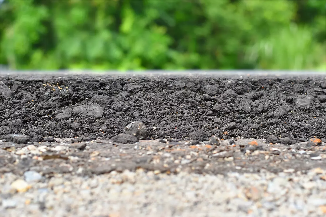 layer of asphalt raw material in a shallow dept of field.