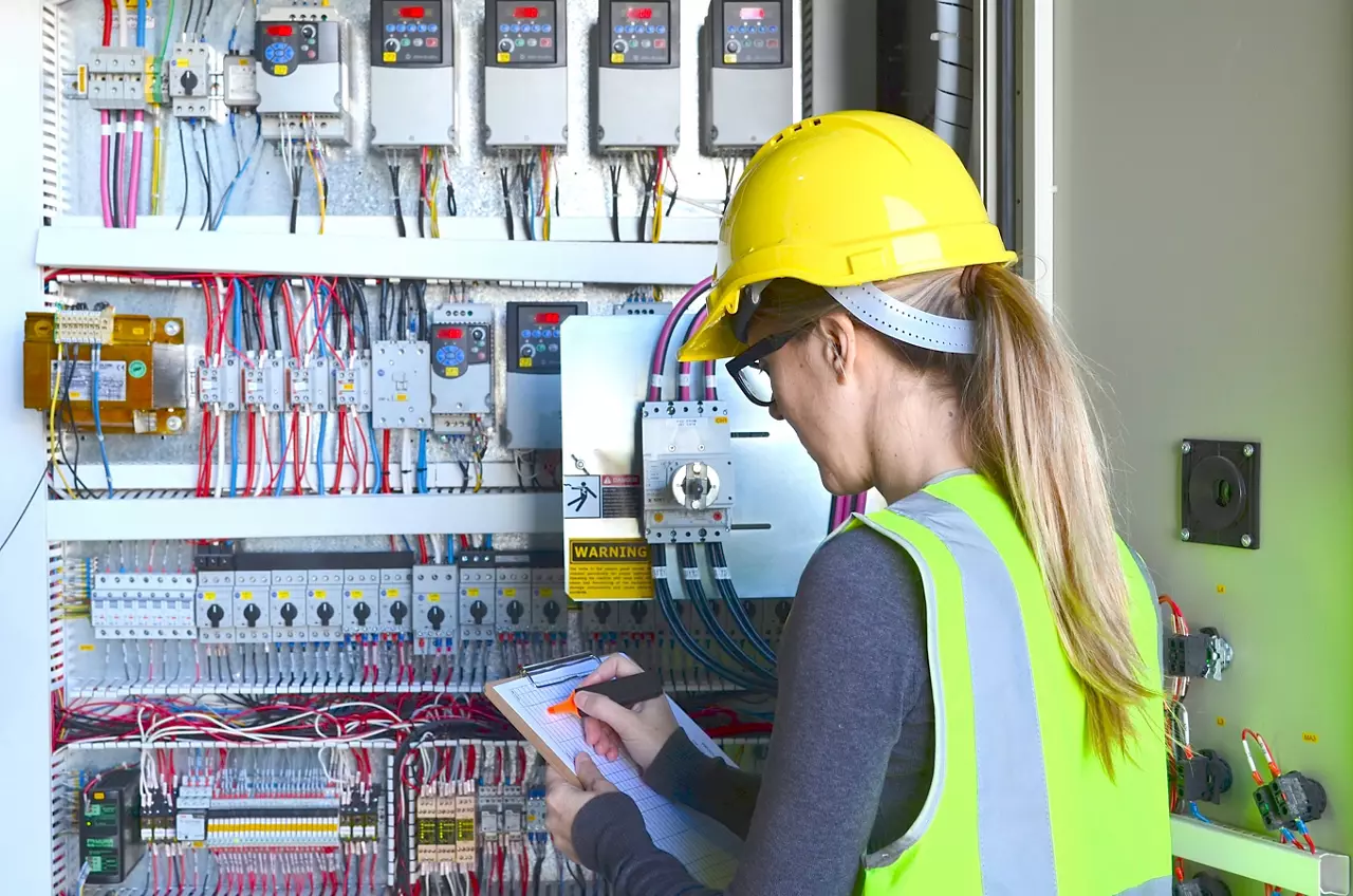 Female safety inspector investigating a factory work site