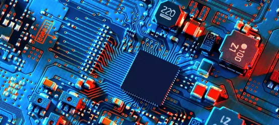 Blue electronic circuit board close up.