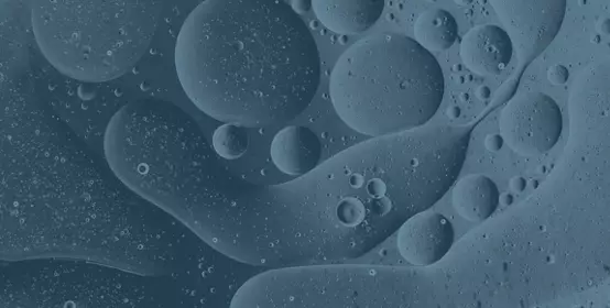 Full frame of the textures formed by the bubbles and drops of oil in the shape of circle floating - slate texture