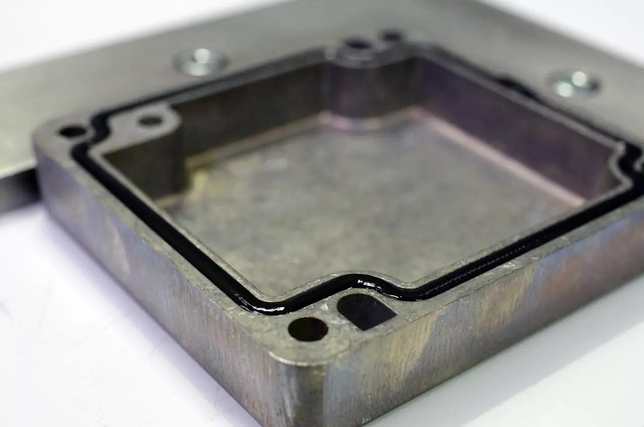 Black silicone adhesive dispensed 