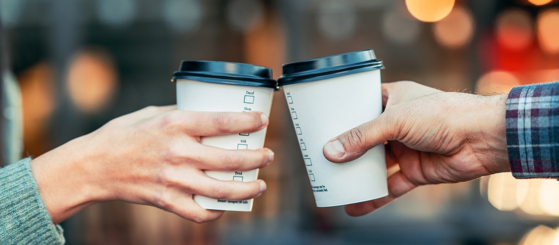 A toast with two paper coffee cups