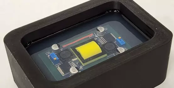 Picture of DOWSIL™ OR-2000 Standard Hard Gel potting a mock board.
