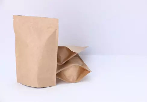 Brown paper stand-up pouches on white background