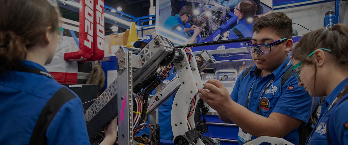 Students working on their robot at FIRST Robotics