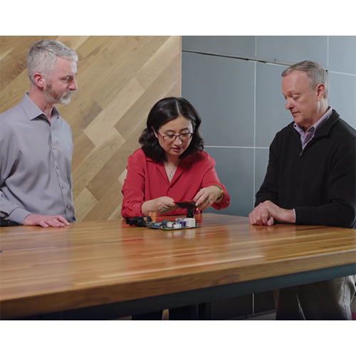 Joyce Liu talking about electronics cooling solutions with colleagues