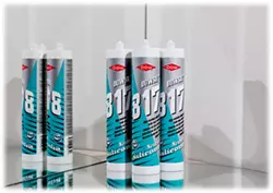 Woman calking window  