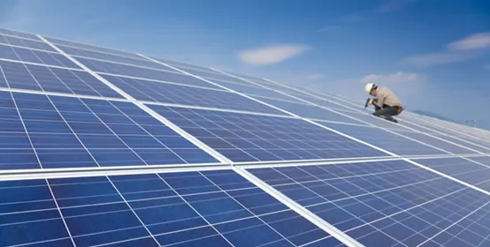 close up solar panel and professional worker installing photovoltaic solar panels